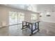 Open concept living room featuring polished concrete floors and access to the backyard pool at 5330 E Tierra Buena Ln, Scottsdale, AZ 85254