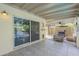 Covered patio featuring tiled floor and sliding glass door overlooking the refreshing pool and backyard at 5330 E Tierra Buena Ln, Scottsdale, AZ 85254