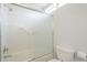 Shower-tub combo with a sliding glass door and white tiling at 5330 E Tierra Buena Ln, Scottsdale, AZ 85254