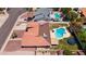 Aerial view of the home, highlighting the roof, pool, outdoor entertainment area, and yard at 5415 E Juniper Ave, Scottsdale, AZ 85254