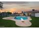 Wonderful backyard features a diving board and lounge seating next to the swimming pool at 5415 E Juniper Ave, Scottsdale, AZ 85254