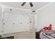 Bedroom with a spacious closet, soft lighting, and cozy decor for a comfortable space at 5415 E Juniper Ave, Scottsdale, AZ 85254