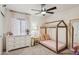 Charming bedroom featuring a whimsical canopy bed, white dresser, and floral curtains for a cozy atmosphere at 5415 E Juniper Ave, Scottsdale, AZ 85254
