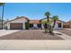 Charming single-story home featuring desert landscaping, a tile roof, and inviting curb appeal at 5415 E Juniper Ave, Scottsdale, AZ 85254
