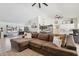 Expansive living area with a comfortable sectional, tile flooring, and great flow to the kitchen at 5415 E Juniper Ave, Scottsdale, AZ 85254