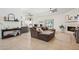 Spacious living room with tile floors, fireplace, and open layout to the kitchen at 5415 E Juniper Ave, Scottsdale, AZ 85254