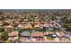 Wide aerial shot of a densely populated neighborhood with many tile roofs in Phoenix, AZ at 5415 E Juniper Ave, Scottsdale, AZ 85254