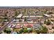 Wide aerial shot of a Phoenix neighborhood with tile roofs, pools, and mature landscaping at 5415 E Juniper Ave, Scottsdale, AZ 85254