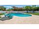 Backyard featuring a private pool with a sundeck and surrounding greenery for outdoor enjoyment at 5415 E Juniper Ave, Scottsdale, AZ 85254