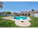 Inviting backyard features a diving board and lounge seating next to the swimming pool at 5415 E Juniper Ave, Scottsdale, AZ 85254