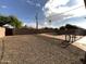 This home features a pool and low-maintenance gravel landscaping in the backyard at 5539 W Wilshire Dr, Phoenix, AZ 85035