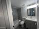 Updated bathroom with modern vanity and tiled shower-tub combo at 5539 W Wilshire Dr, Phoenix, AZ 85035
