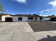 Charming single-story home with well-maintained gravel landscaping and wide driveway at 5539 W Wilshire Dr, Phoenix, AZ 85035