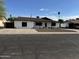 Traditional one-story home exterior with a simple front yard design and driveway at 5539 W Wilshire Dr, Phoenix, AZ 85035