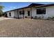 Charming single-story home with a well-maintained rock yard and covered entry at 5539 W Wilshire Dr, Phoenix, AZ 85035
