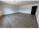 Spacious living room with neutral walls and tile flooring at 5539 W Wilshire Dr, Phoenix, AZ 85035