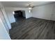 Bright living area featuring stylish flooring and an open layout into the kitchen at 5539 W Wilshire Dr, Phoenix, AZ 85035