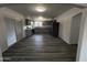 Open kitchen and dining floorplan featuring grey cabinets, granite countertops, stainless appliances and wood flooring at 5539 W Wilshire Dr, Phoenix, AZ 85035