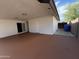 Spacious covered patio featuring a sliding door, and side door with concrete flooring, perfect for outdoor entertaining at 5539 W Wilshire Dr, Phoenix, AZ 85035