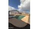 Backyard view of the private in-ground pool, diving board, and patio area at 5539 W Wilshire Dr, Phoenix, AZ 85035
