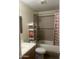 Cozy bathroom featuring a tub with shower, tiled walls and vanity at 6226 W Citrus Way, Glendale, AZ 85301