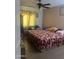Cozy bedroom with tile flooring and soft, patterned bedding at 6226 W Citrus Way, Glendale, AZ 85301