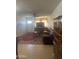 Comfortable living room with tile floors, a ceiling fan, and a leather sofa at 6226 W Citrus Way, Glendale, AZ 85301