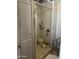Basic tiled shower stall with a curtain and essential toiletries at 6226 W Citrus Way, Glendale, AZ 85301