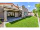 Backyard featuring artificial turf, patio, and lush landscaping, perfect for outdoor enjoyment at 6597 N 79Th Pl, Scottsdale, AZ 85250