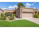 Charming home with well-maintained lawn and a two-car garage at 6597 N 79Th Pl, Scottsdale, AZ 85250