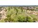 Beautiful aerial of a golf course highlighting manicured greens and mature trees in a well-maintained community at 6597 N 79Th Pl, Scottsdale, AZ 85250