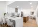 Stylish kitchen with island counter seating, stainless appliances, and white cabinets at 6597 N 79Th Pl, Scottsdale, AZ 85250