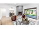 Bright living room featuring a fireplace, wet bar, modern furniture, and a seamless transition to the outdoor patio at 6597 N 79Th Pl, Scottsdale, AZ 85250