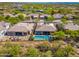 An expansive view showing an outdoor oasis with an in-ground pool, lounge chairs, and desert landscaping at 6996 E Mighty Saguaro Way, Scottsdale, AZ 85266