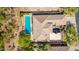 An expansive view of a backyard with an in-ground pool, desert landscaping and a tile roof home at 6996 E Mighty Saguaro Way, Scottsdale, AZ 85266