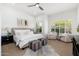 Serene primary bedroom with plush decor, natural light, and wood flooring for a relaxing retreat at 6996 E Mighty Saguaro Way, Scottsdale, AZ 85266