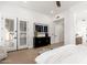 Bedroom with closet access, modern furniture, and lots of natural light at 6996 E Mighty Saguaro Way, Scottsdale, AZ 85266