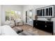 Bedroom with ample light from shuttered windows, offering a tranquil retreat with stylish furnishings at 6996 E Mighty Saguaro Way, Scottsdale, AZ 85266