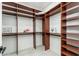 A spacious walk-in closet features custom shelving and ample storage for an organized wardrobe at 6996 E Mighty Saguaro Way, Scottsdale, AZ 85266