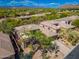 Charming desert home featuring drought-resistant landscaping, a stone driveway, and a tile roof at 6996 E Mighty Saguaro Way, Scottsdale, AZ 85266