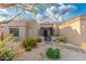 Home exterior featuring desert landscaping, decorative rocks and beautiful plants at 6996 E Mighty Saguaro Way, Scottsdale, AZ 85266
