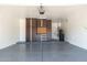 Clean and organized garage with epoxy flooring, ample cabinet space, and efficient storage solutions at 6996 E Mighty Saguaro Way, Scottsdale, AZ 85266