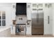 Bright open kitchen featuring stainless steel appliances, and white cabinetry at 6996 E Mighty Saguaro Way, Scottsdale, AZ 85266