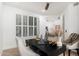 Bright home office featuring shutters, white walls, and a modern desk setup with decor accents at 6996 E Mighty Saguaro Way, Scottsdale, AZ 85266