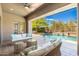 Inviting outdoor patio with comfortable seating, perfect for relaxing poolside and enjoying the desert landscape at 6996 E Mighty Saguaro Way, Scottsdale, AZ 85266