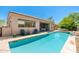Backyard swimming pool featuring water feature, lounge seating, and backyard desert landscaping at 6996 E Mighty Saguaro Way, Scottsdale, AZ 85266