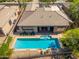 Inviting backyard oasis featuring sparkling rectangular pool, patio seating, and convenient access from the home's interior at 6996 E Mighty Saguaro Way, Scottsdale, AZ 85266
