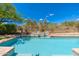 Backyard swimming pool featuring waterfall, desert landscaping, and fenced perimeter at 6996 E Mighty Saguaro Way, Scottsdale, AZ 85266