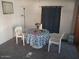 The dining area includes a table, chairs, and a bright area with natural light at 701 S Dobson Rd # 438, Mesa, AZ 85202