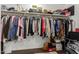 Walk-in closet with ample storage space including shelving and hanging rods at 7064 W Lincoln St, Peoria, AZ 85345